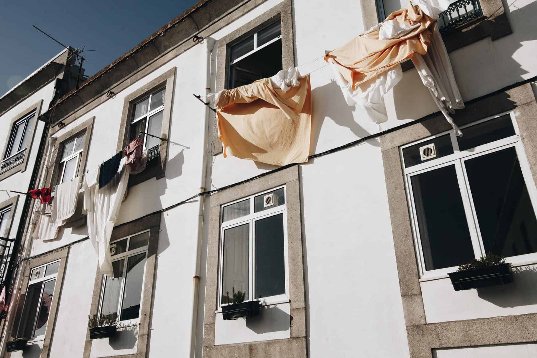 clothes hanged on wire beside house